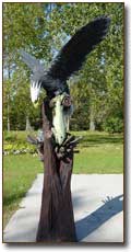 Eagle with Fish - Chainsaw Sculpture by James W. Denkins